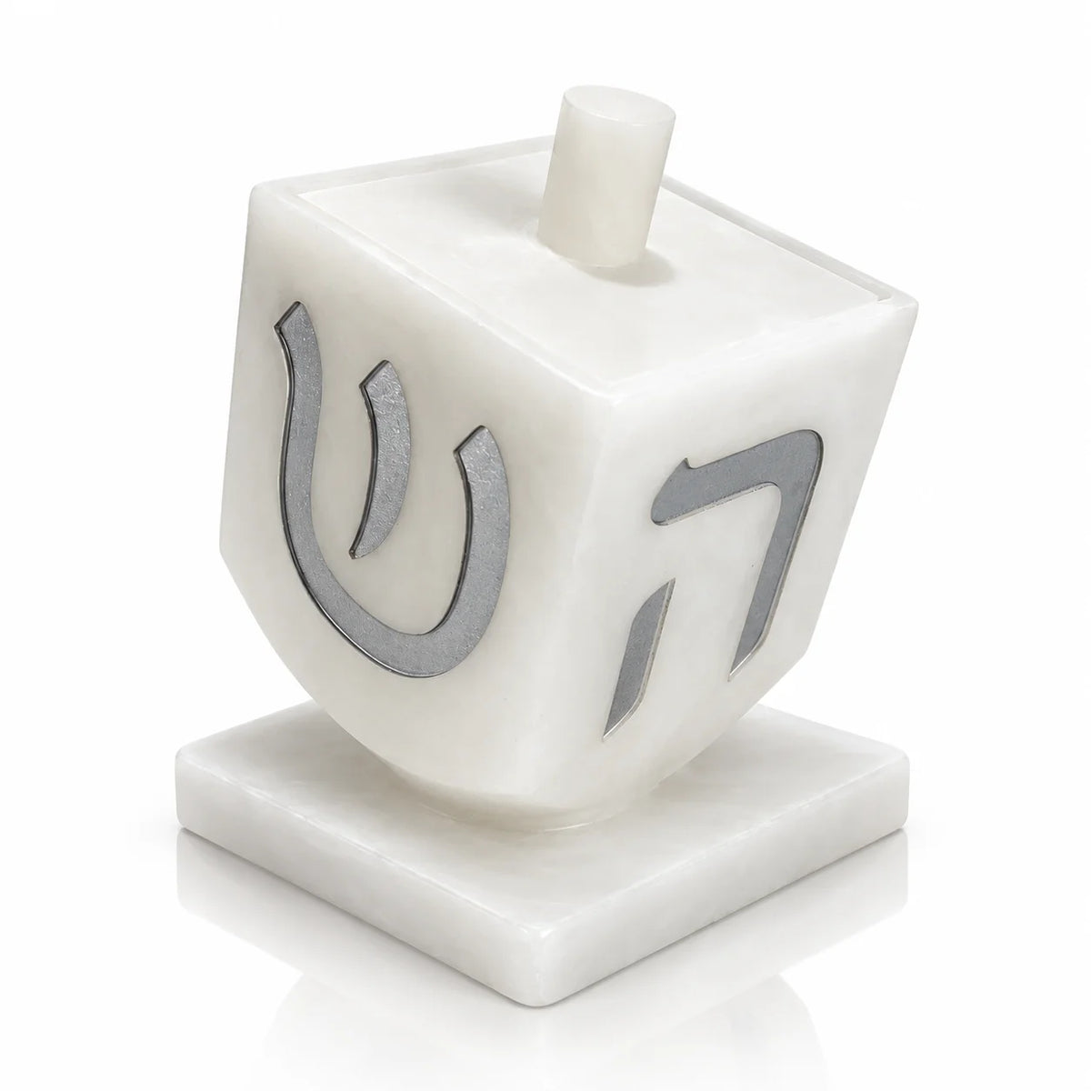 Silver resin dreidel sculpture match jar for Hanukkah (חנוכה), a sculptural match holder beside the menorah