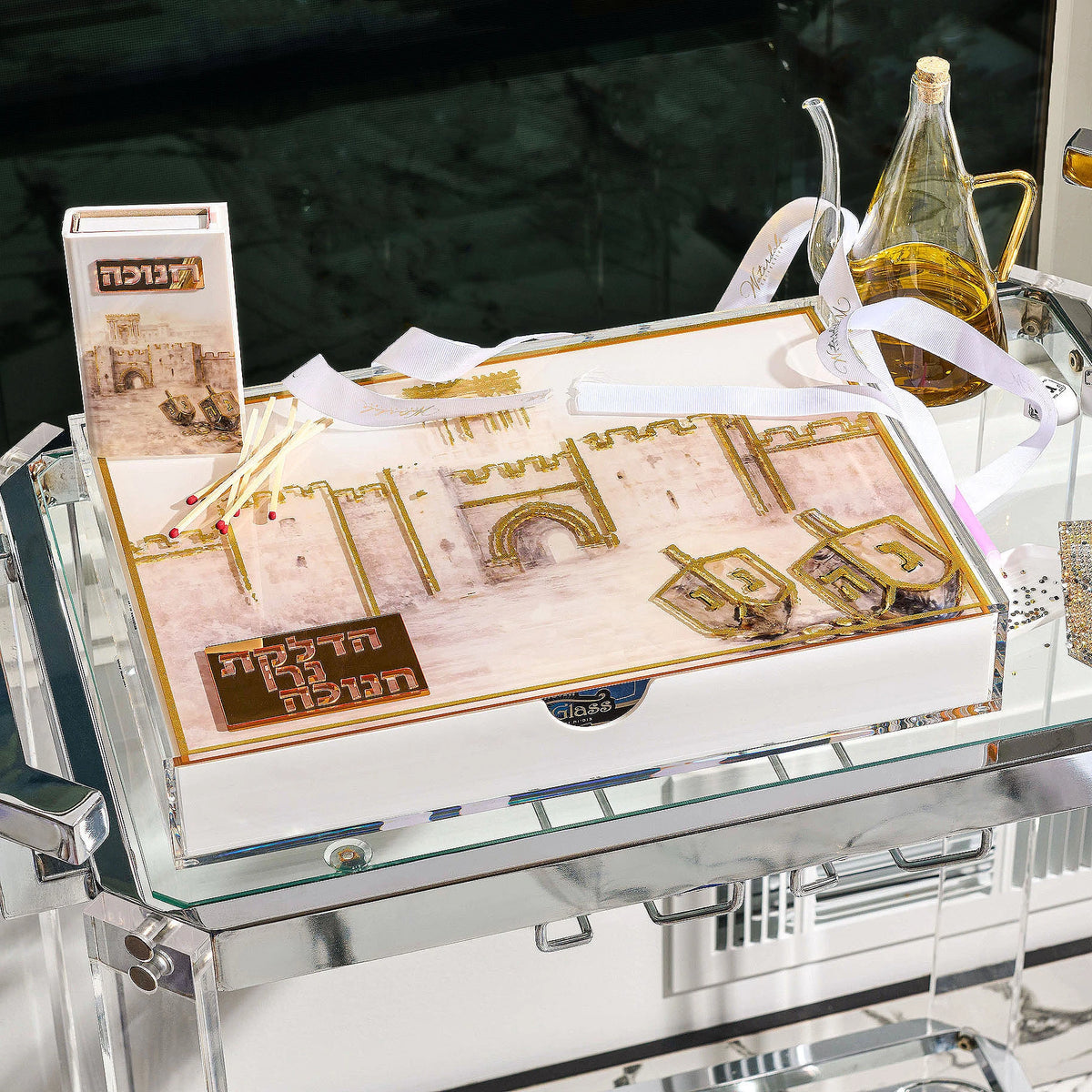 Jerusalem Old City painted lucite menorah tray with hidden drawer and gold Hadlakat Ner Chanukah plaque on a tray with chanukah items