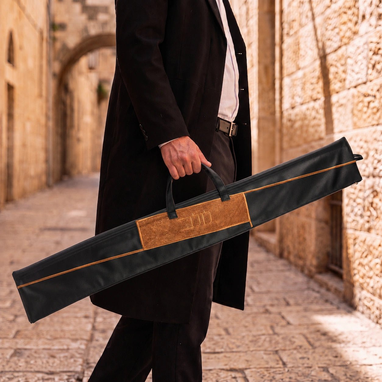 Black Geometric Fur Leather Lulav Case | Man carrying a lulav case in Jerusalem