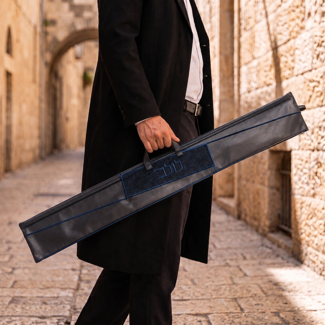 Navy Geometric Fur Leather Lulav Case | Man carrying a lulav case in Jerusalem