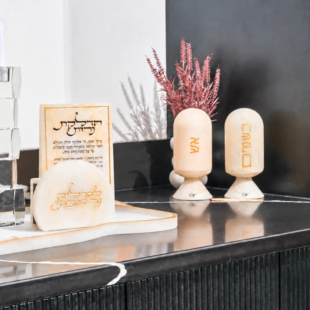 Resin Hadlokas Neiros Set by Waterdale Collection: gold marbled tray, הדלקת נרות block, tzedakah box, matchbox holder, and אש and בשמים cloches for Shabbos
