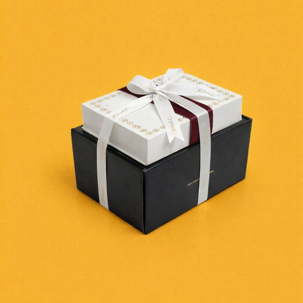 Bencher set silverware caddy packaged in an elegant black and white gift box with ribbon, styled for a luxury Mishloach Manos presentation.