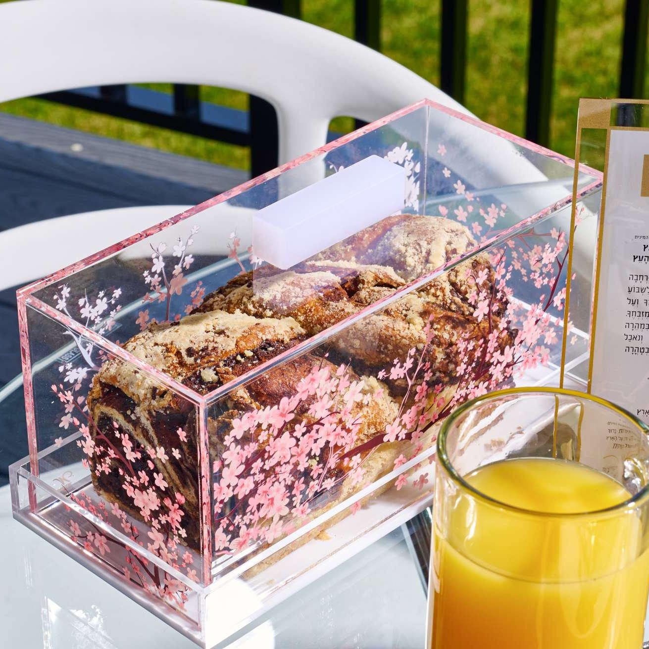 Freshly baked babka displayed in a Cherry Blossom Cake Dome.