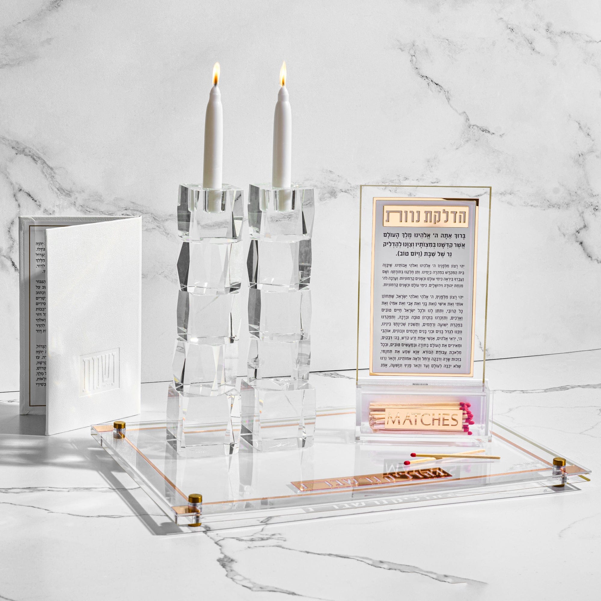 Classic 2.0 Hadlkas Neiros Match Cloche Card displayed on a clear tray with gold hardware against a marble background.