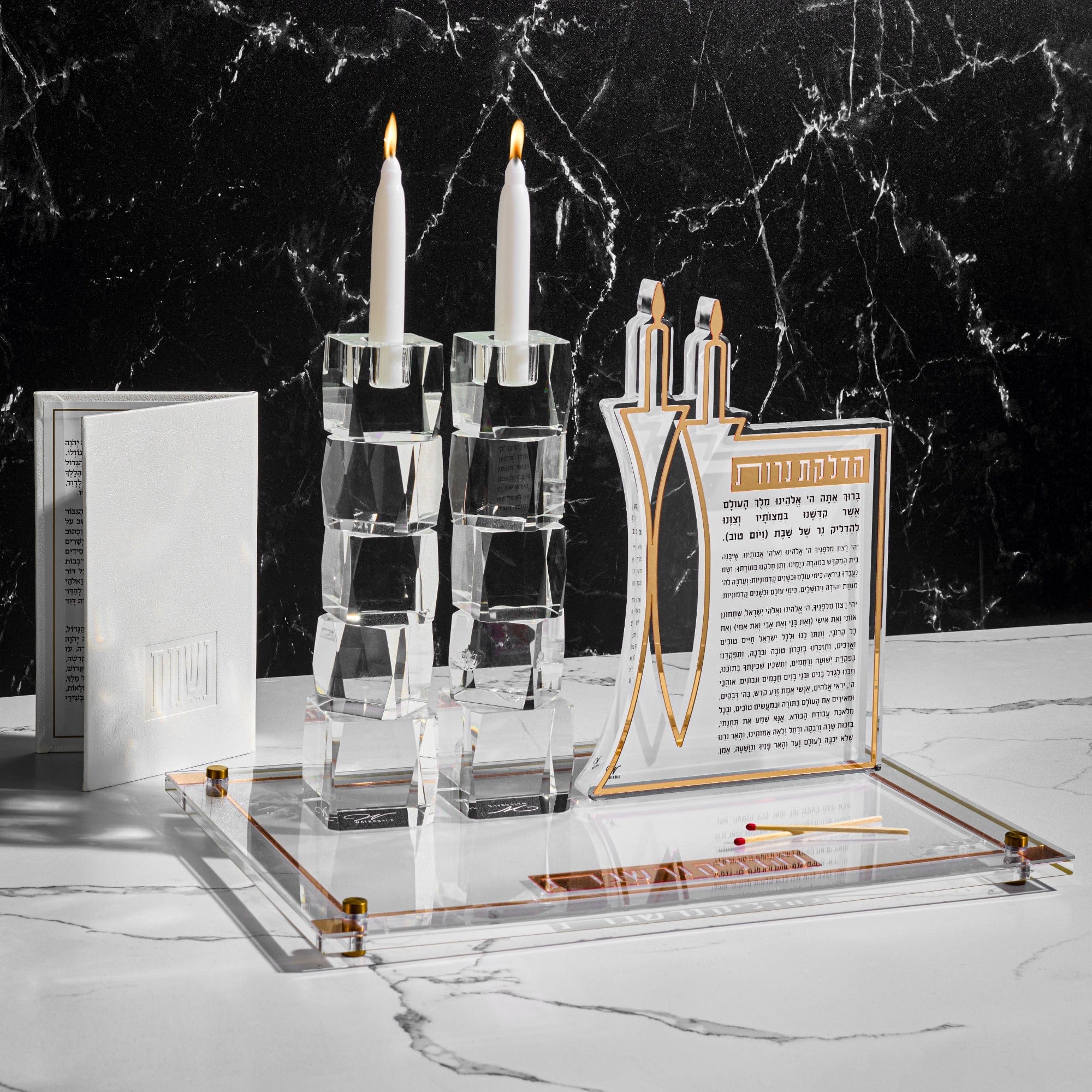 Classic 2.0 Hadlokas Neiros Sculpture and Candlesticks on top of a board