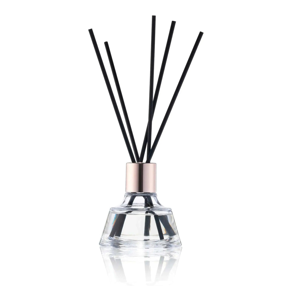 Classic Floral Reed Diffuser by Waterdale Collection with black rattan sticks in clear glass bottle with silver metal collar.
