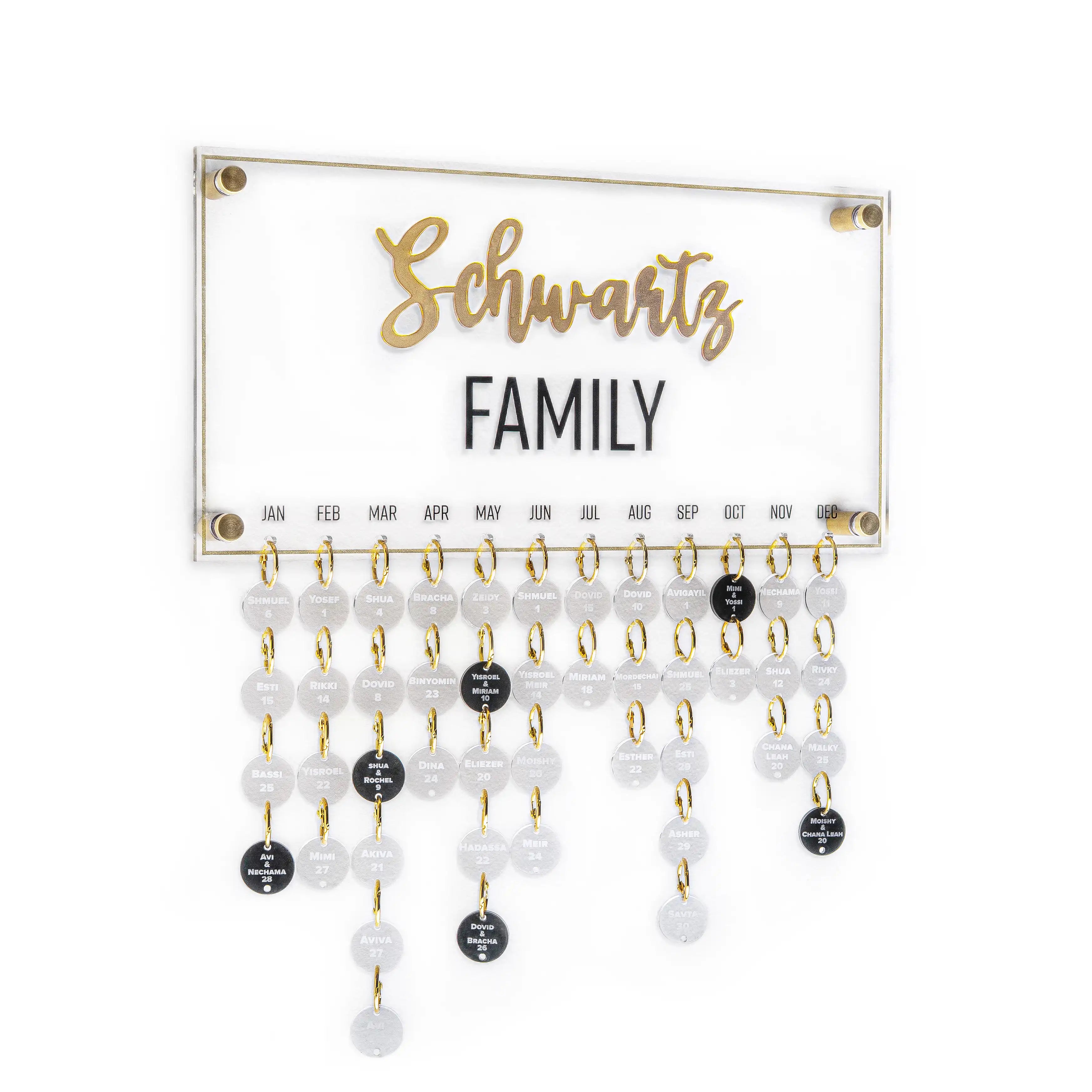 Custom calendar with family birthdays and anniversaries hanging. Crafted from clear lucite in clear with clear and black circles hanging from the main board. Your family name printed in the middle.