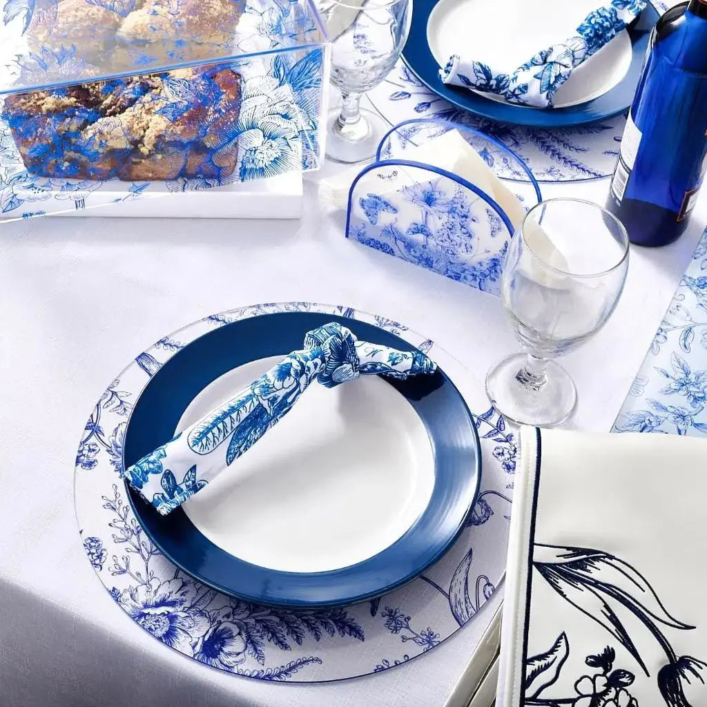 French Toile Charger plate in blue and white with delicate botanical pattern, displayed with matching dinnerware and table setting.