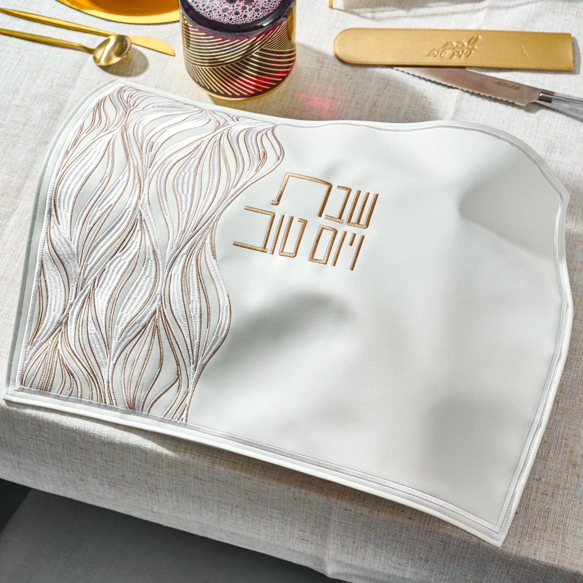 Lace Challah Cover on an elegant holiday table setting.