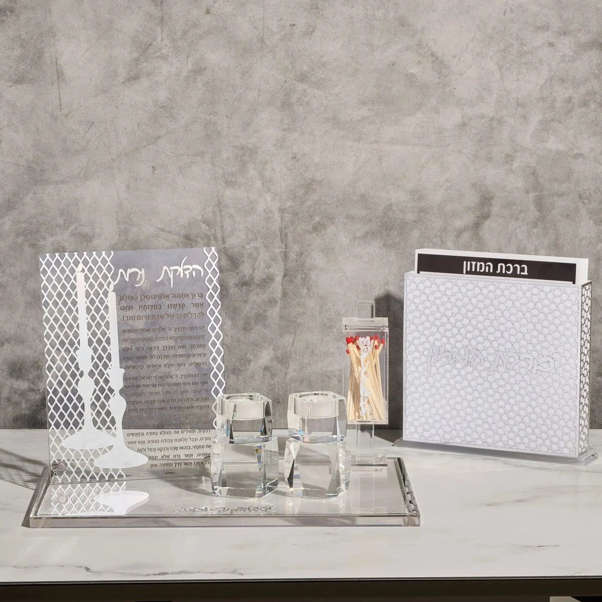 Laser cut bencher set in white with geometric patterns displayed on gray surface, includes matching prayer cards and organizer pieces