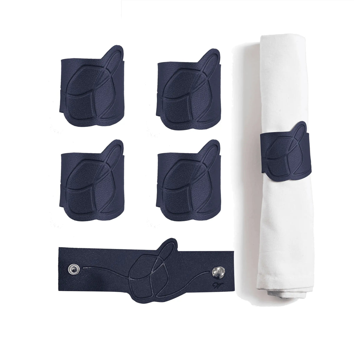Navy leatherette dreidel napkin wraps, a set of four embossed bands with snap closures for Hanukkah dining