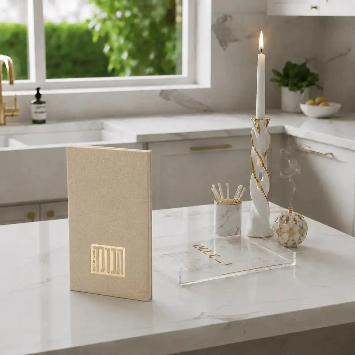 Tan leather Havdalah booklet displayed on white desk with notebook and candle holder in modern home setting.