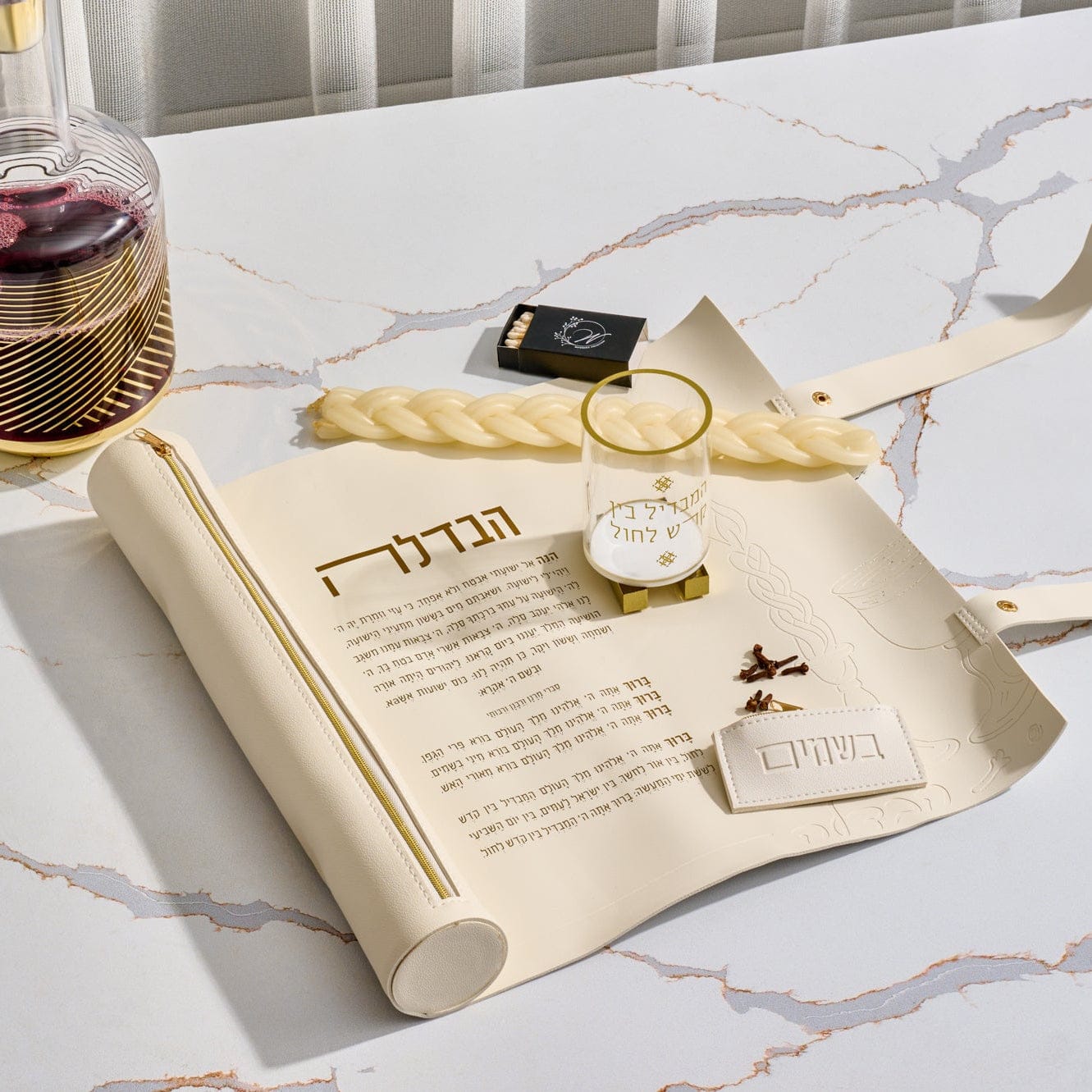 Luxury leather Havdalah mat and tray set in a minimalist cream finish, featuring a durable wipeable surface and elegant Hebrew "Motzai Shabbat" typography by Waterdale Collection.