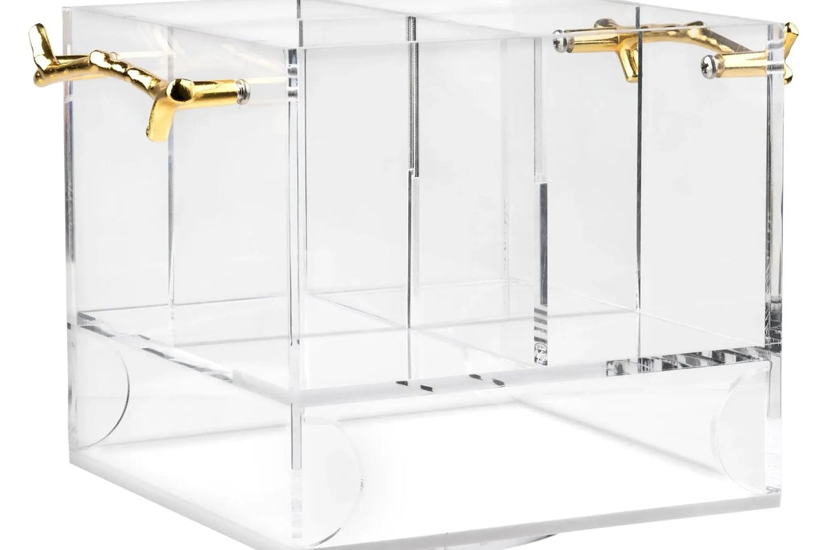 MetaLucite Twig Swivel Silverware Caddy in clear acrylic with brass gold twig-shaped handles and divided compartments for organizing flatware and utensils on the table.