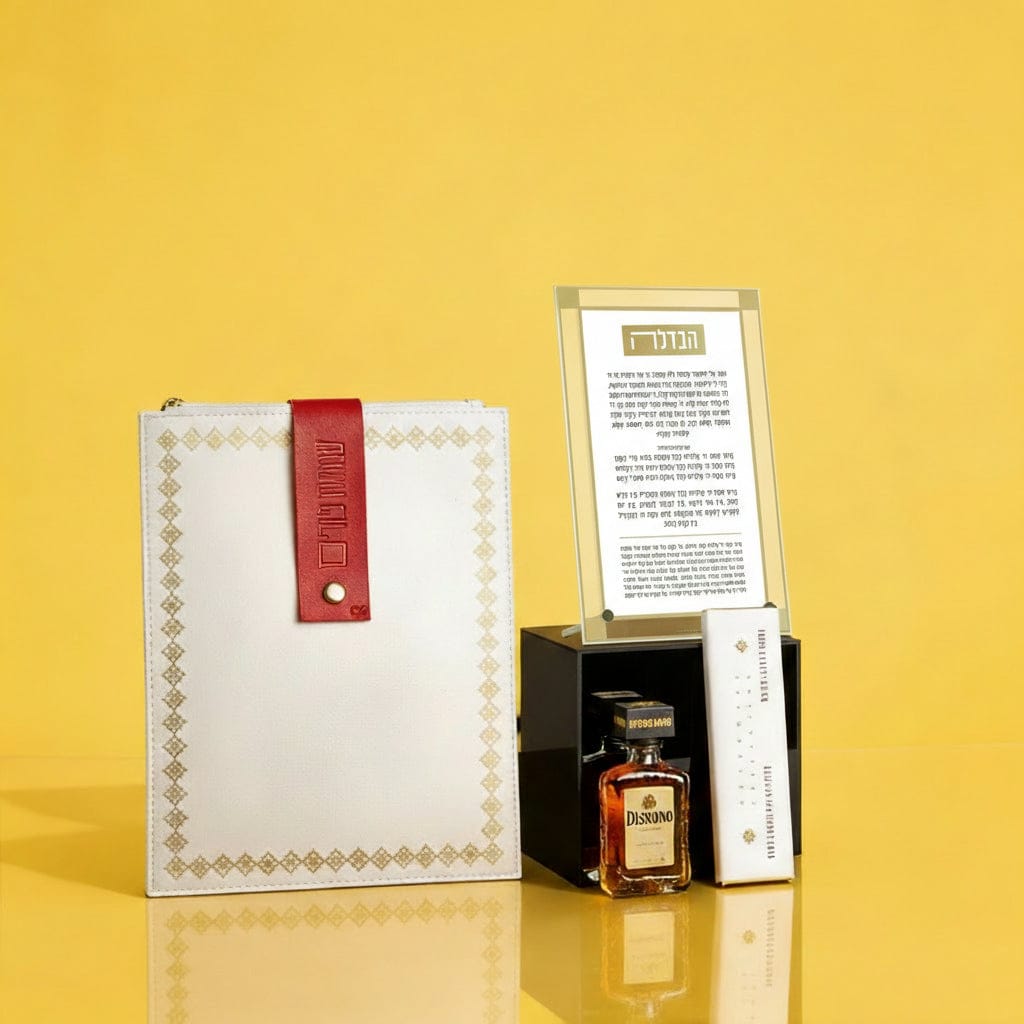 Luxury Mishloach Manot gift set featuring a gold-bordered Havdalah prayer card in a lucite stand, a white leatherette pouch with a red "Simchat Purim" strap, and a mini Disaronno liqueur.