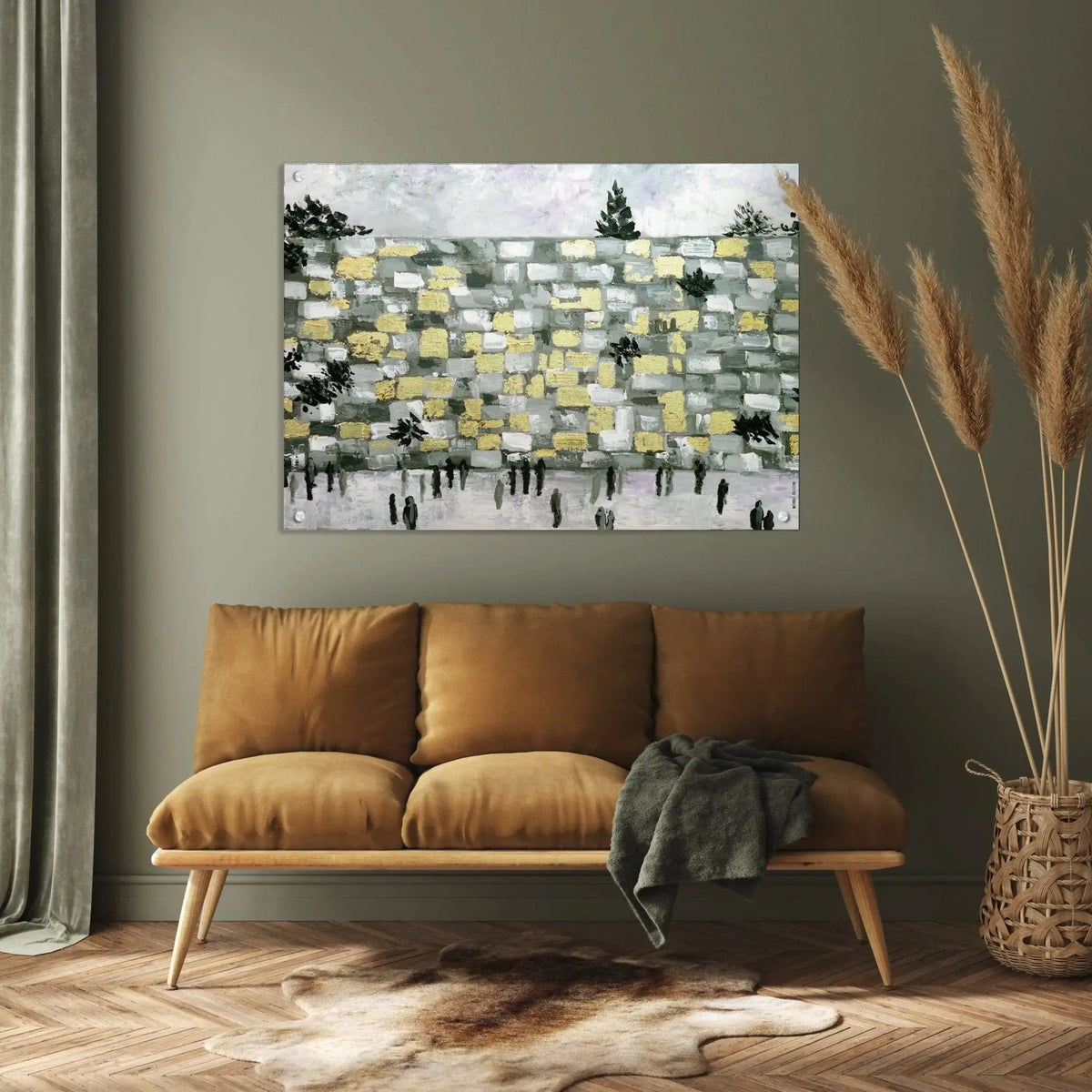 Modern Kosel Painting by Waterdale Collection featuring an abstract Jerusalem landscape in muted earth tones, displayed above a tan leather sofa in a contemporary living room setting.
