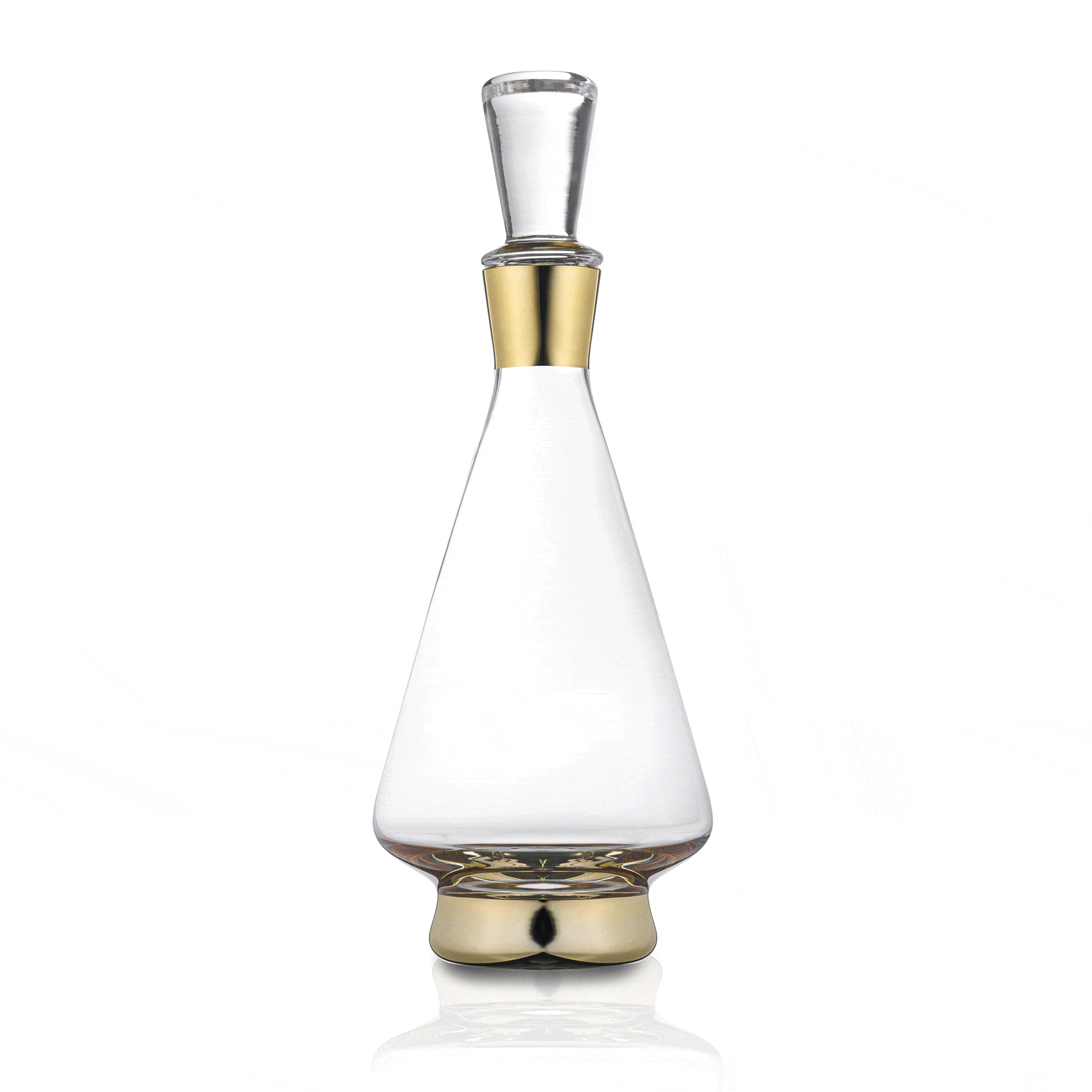 Modern wine decanter with clear glass cone-shaped body, brass-gold metal base and stopper, elegant stemware design for wine serving and display.