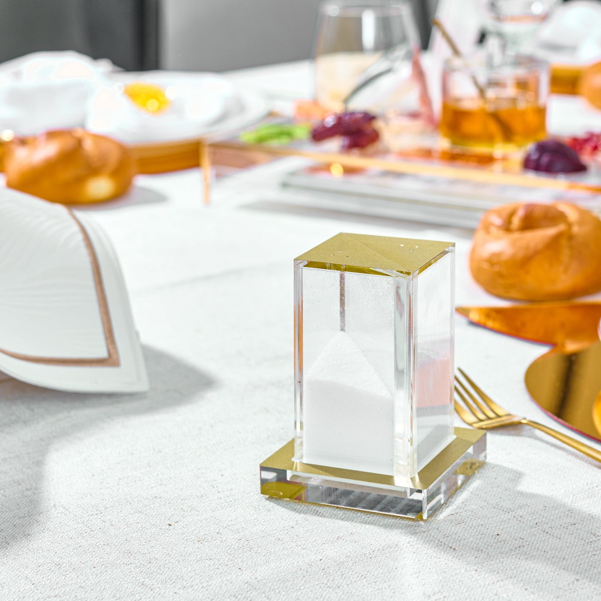 Modular Salt Shakers on a Shabbat table setting.