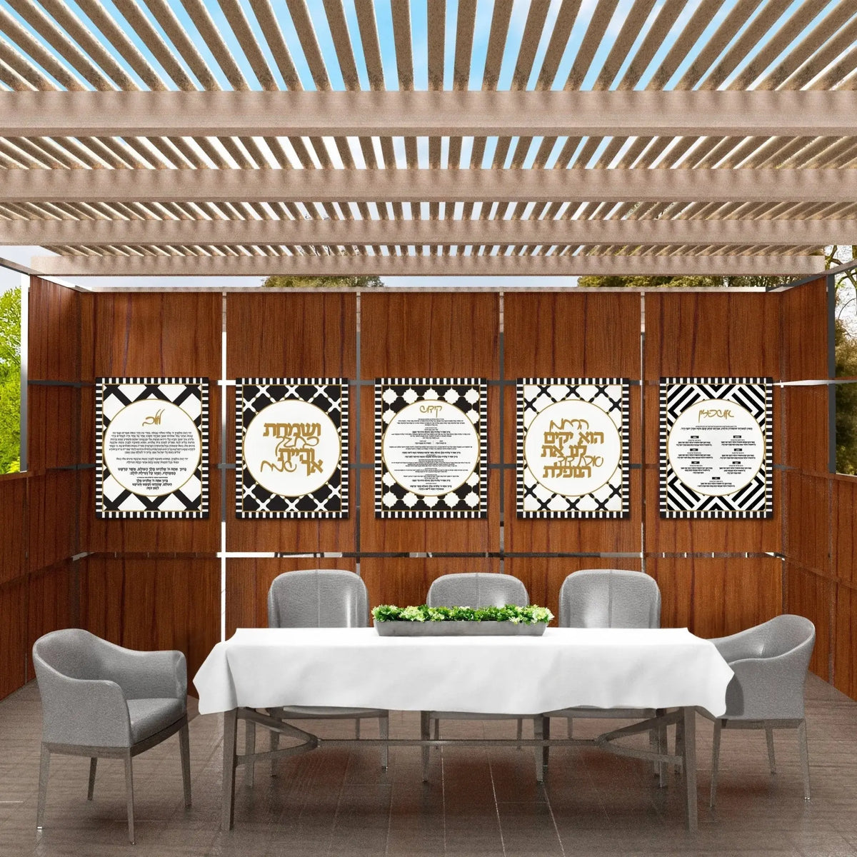 Five Onyx sukkah decorations grouped on a wood sukkah wall in black, white and gold, from Waterdale Collection.