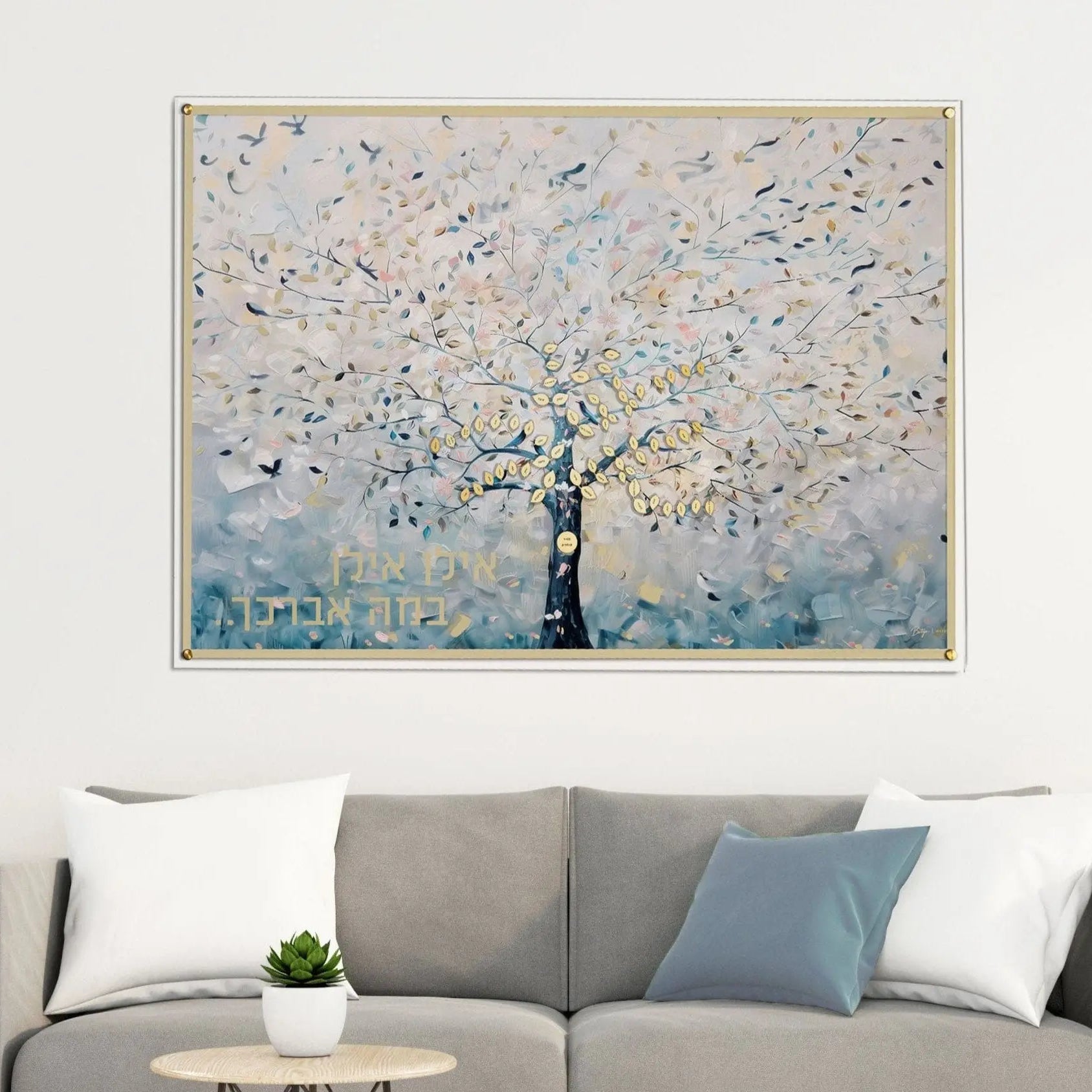Customizable "Whisper" family tree painting by Batya on clear lucite, featuring a modern abstract tree design with ethereal gold accents and personalized family names hang up on a living room wall