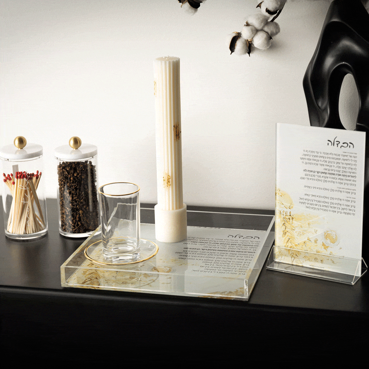 Lucite Painted Havdalah Card in cream and gold tones displayed on marble stand with Jewish ceremonial items and product information card visible.