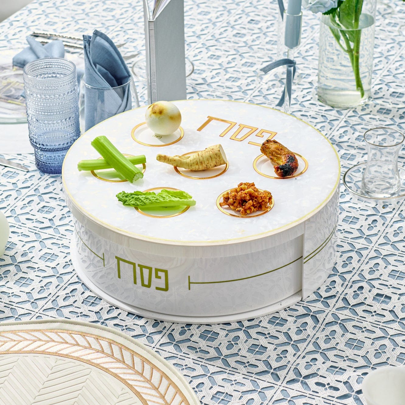 Pearlstone 3 Level Spinning Seder Plate with white and gold design, rotating Passover Seder plate with Hebrew Pesach labels and matzah storage, luxury Judaica Pesach table centerpiece for holiday entertaining.