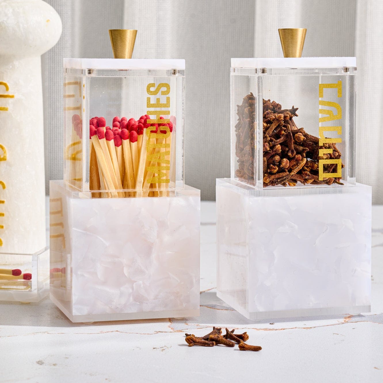 Pearlstone Block Match Holder featuring a clear lucite match container with gold “Matches” lettering and a sleek gold-tone knob, set atop a solid pearlstone-style resin block base for an elegant and modern tabletop display.