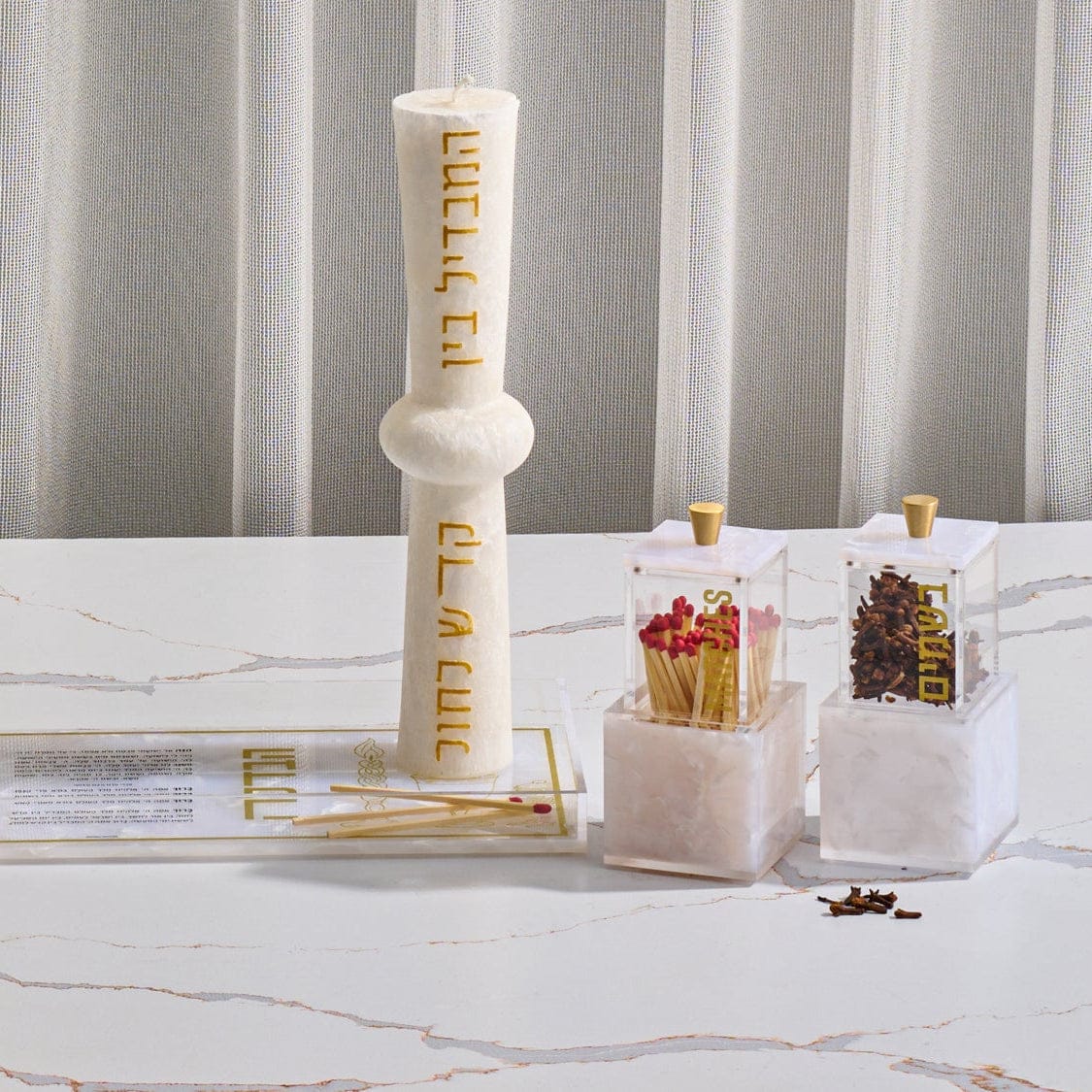 Pearlstone Block Match Holder featuring a clear lucite match container with gold “Matches” lettering and a sleek gold-tone knob, set atop a solid pearlstone-style resin block base, designed to coordinate beautifully with modern Shabbos and Havdalah displays.