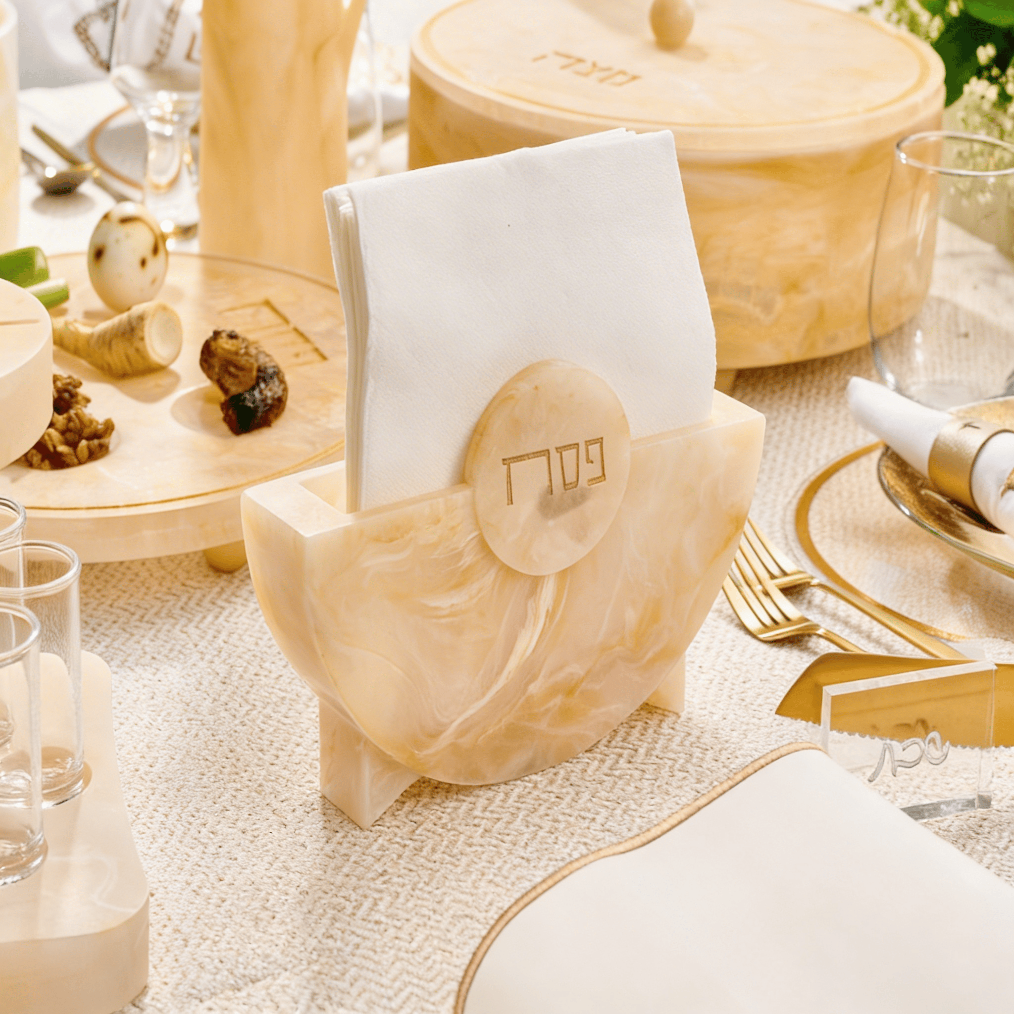 Pesach Resin Napkin Holder in marble cream finish with Hebrew Pesach lettering, elegant Judaica napkin holder for Passover Seder table, modern luxury holiday table decor.