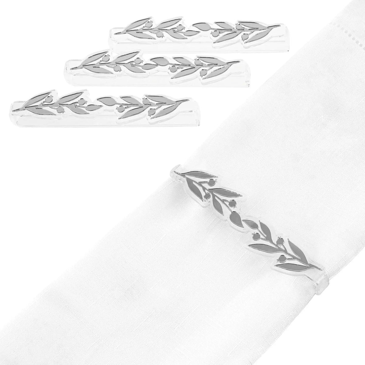 Silver pomegranate leaf napkin wraps arranged in rows, showing metallic leaf-shaped napkin rings for holiday table settings.