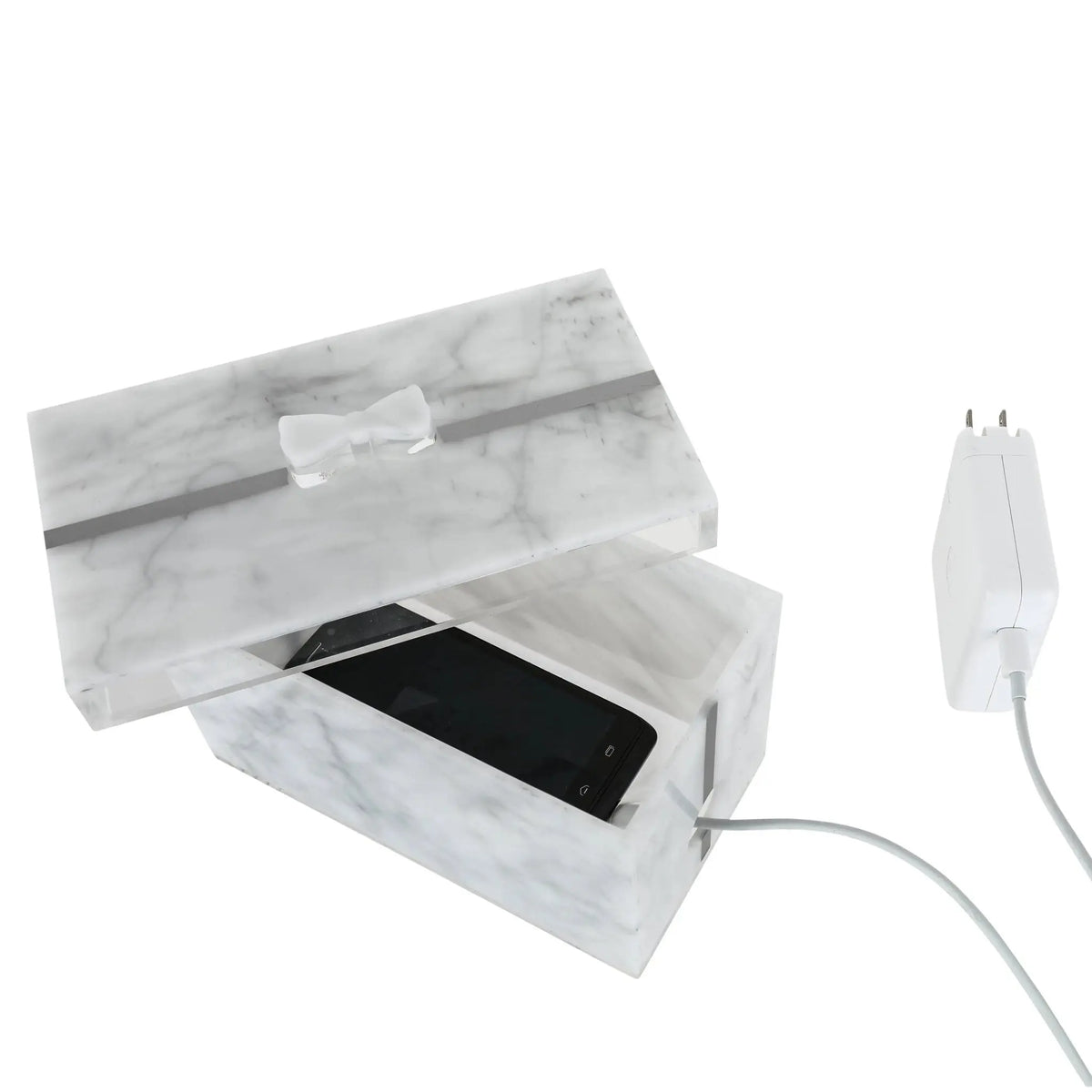 Marble present box with clear acrylic lid displaying smartphone charging cable, tabletop organizer by Waterdale Collection.