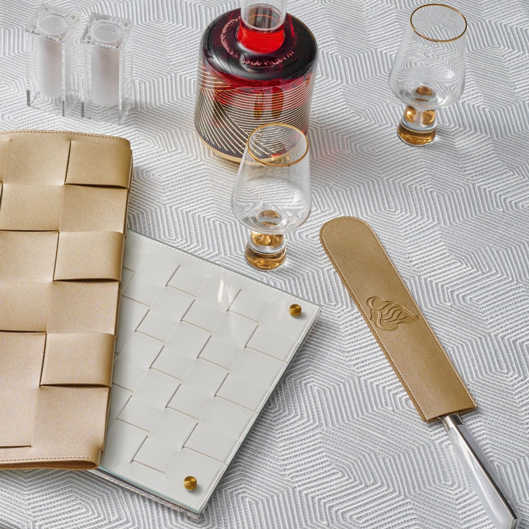 Regal Knife Blade Cover displayed on an elegant white patterned tablecloth with matching tableware