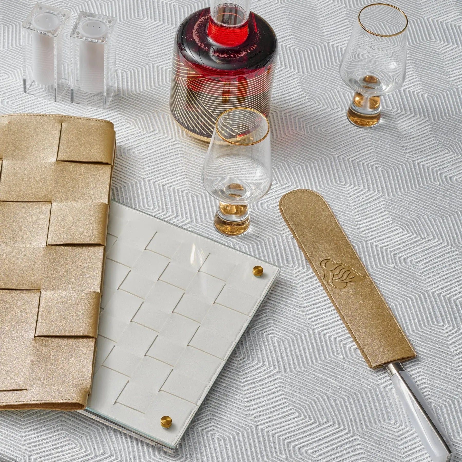 Regal Knife Blade Cover displayed on an elegant white patterned tablecloth with matching tableware