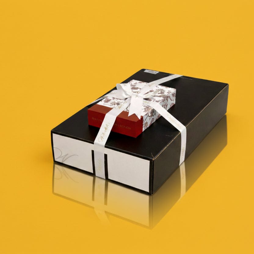 Contemporary neutral resin Challah tray with a minimalist arched silhouette, styled as a premium Purim gift platter for high-end Mishloach Manos presentations.