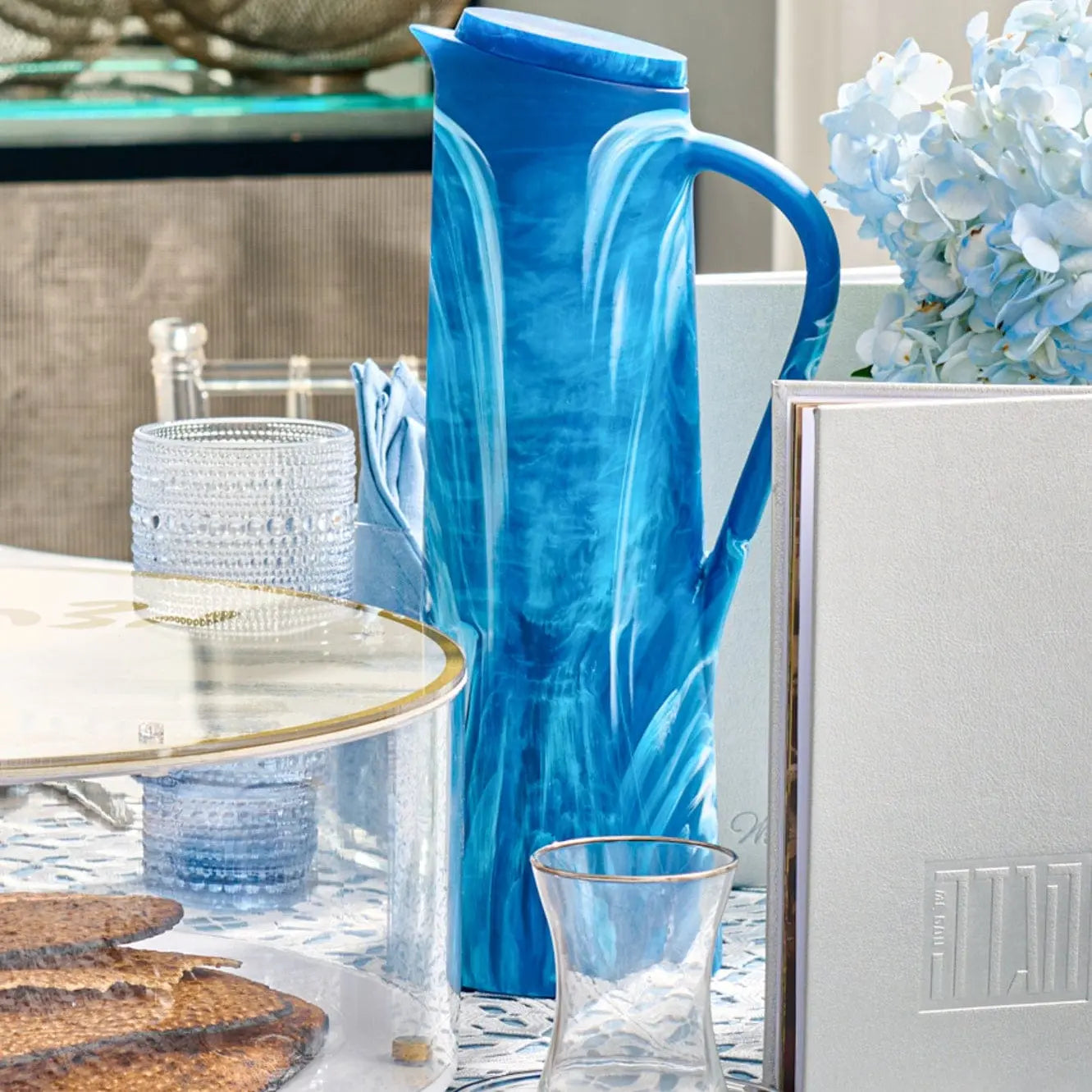 Blue resin pitcher styled on an elegant Shabbat table setting – Waterdale Collection