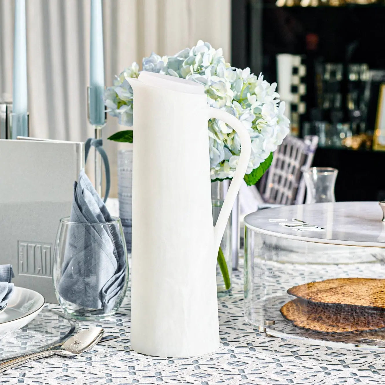 White resin pitcher styled on an elegant Shabbat table setting – Waterdale Collection