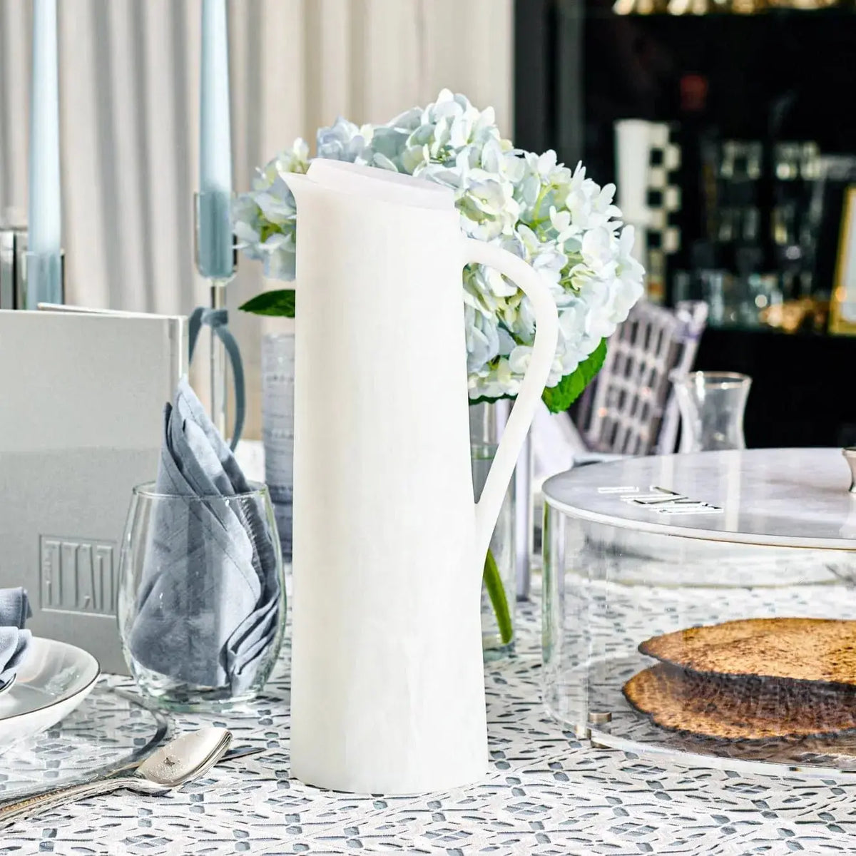 White resin pitcher from Waterdale Collection displayed with flowers and table settings, elegant tabletop decor piece.