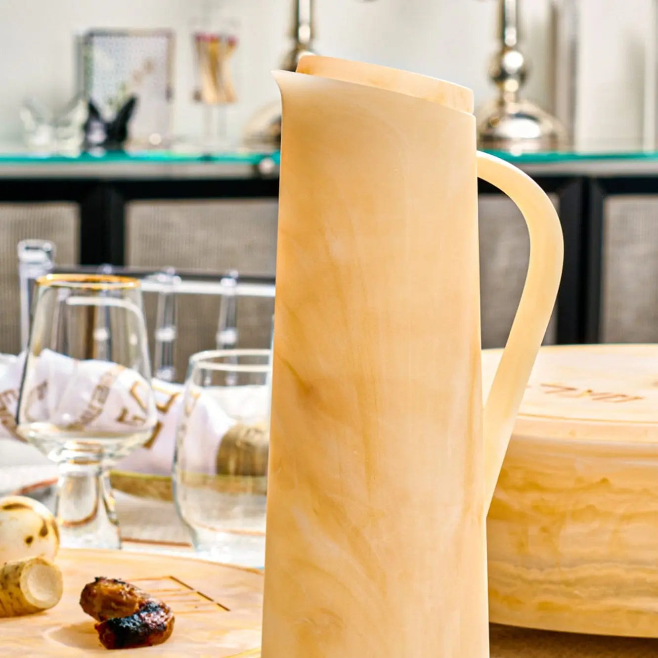 Beige resin pitcher styled on an elegant Shabbat table setting – Waterdale Collection