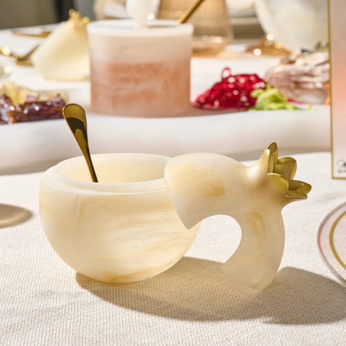Gold pomegranate honey dish in marbled resin for Rosh Hashana table decor