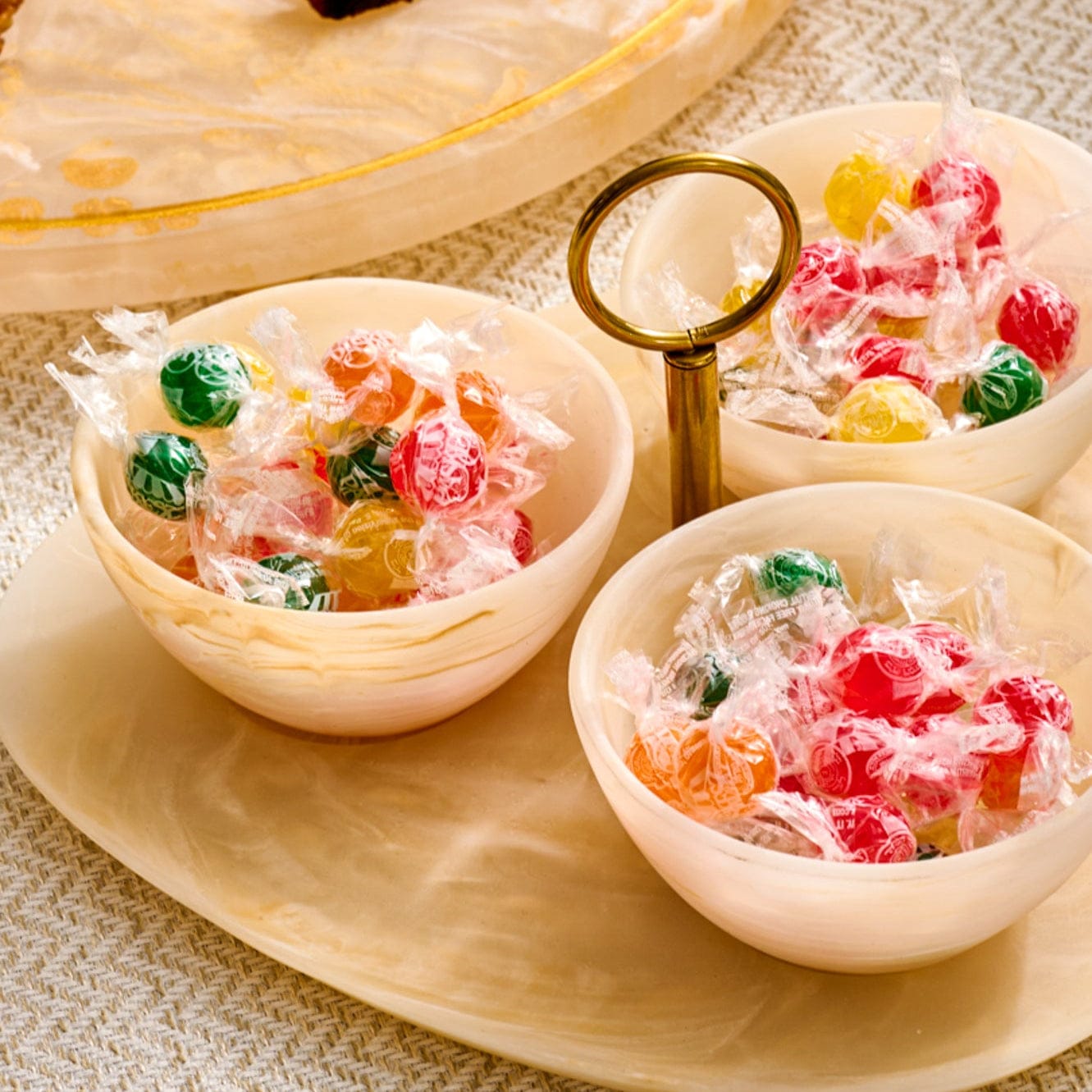 Resin 3-Bowl Serving Set featuring a marbled cream oval tray with three coordinating bowls and a sleek gold-tone center ring handle, perfect for serving candies, nuts.