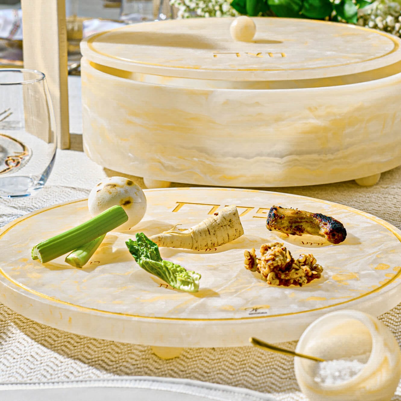Resin Seder Plate with marble-look finish, six clear acrylic bowls, and silver accents for the Passover Seder table.