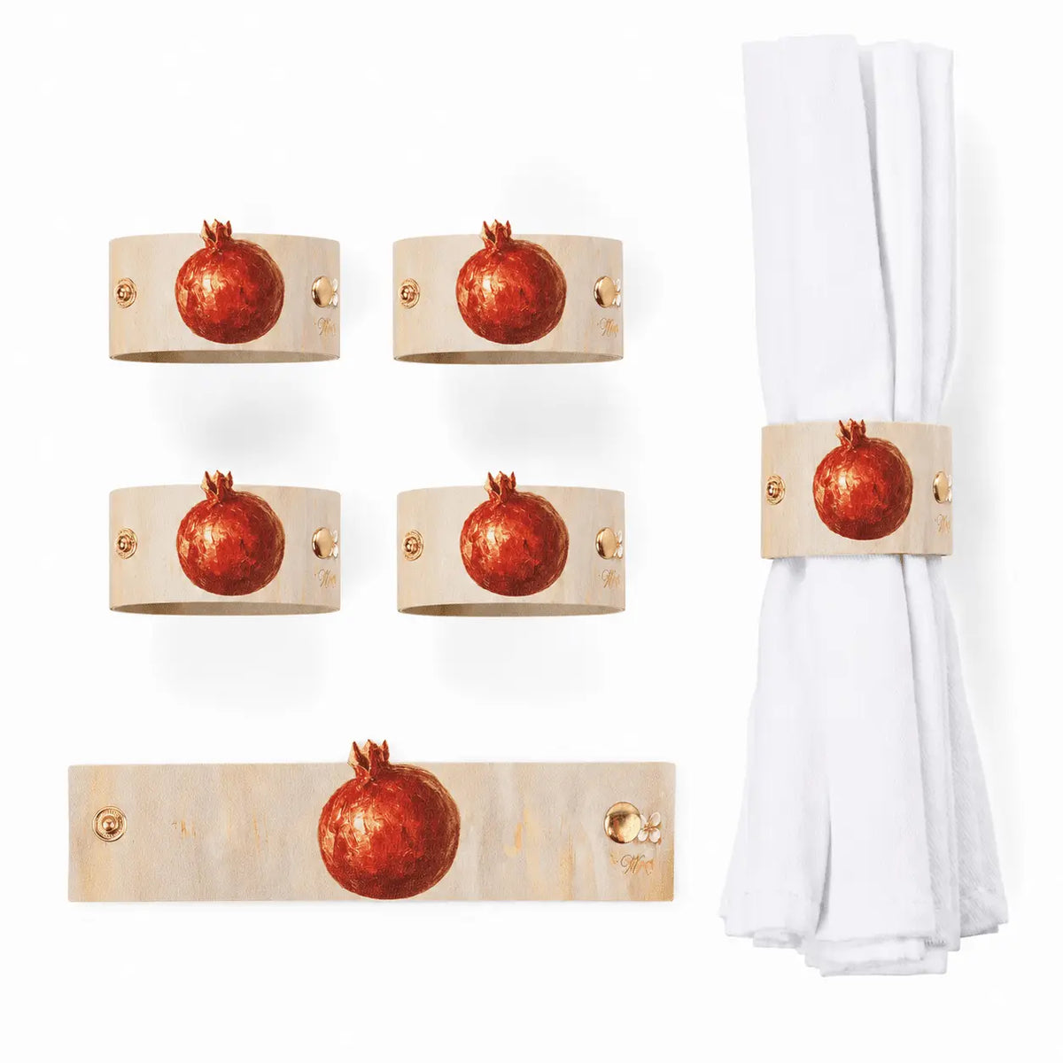 Painted pomegranate napkin wraps on a Rosh Hashonah place setting (ראש