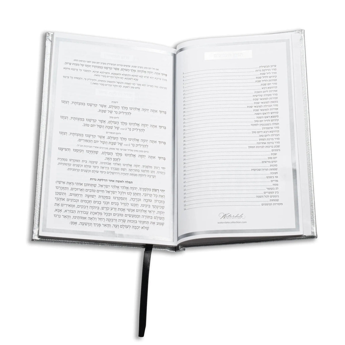 Open Shabbos bencher set showing Hebrew prayer text pages with black binding and bookmark ribbon against white background.