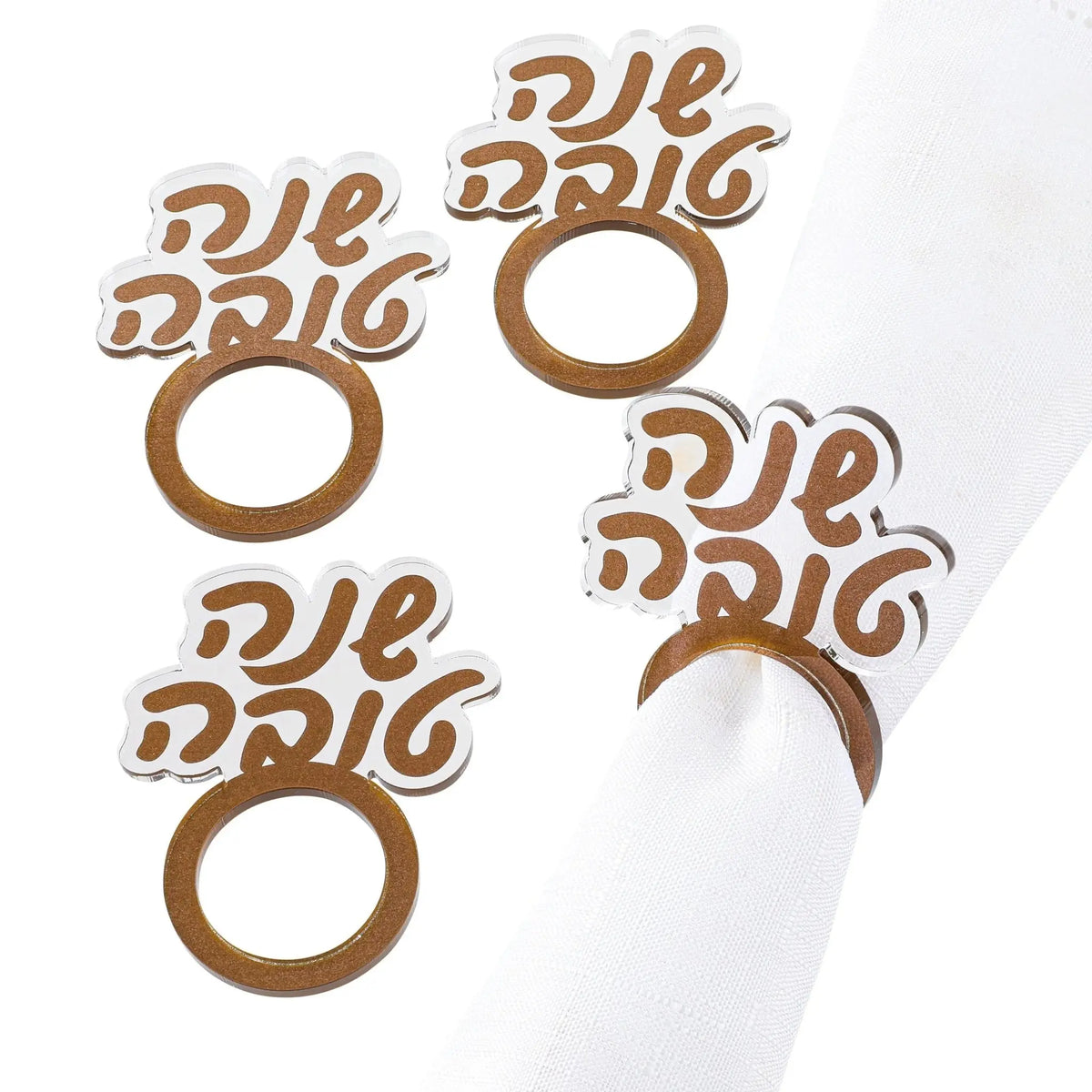 Gold Shana Tova (שנה טובה) napkin rings in Hebrew script, from Waterdale Collection