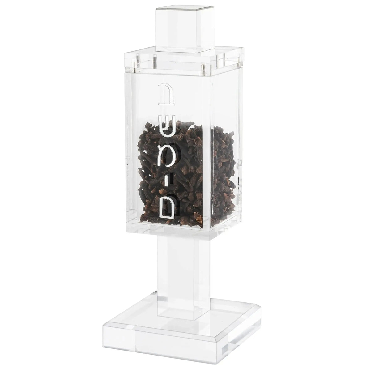 Square clear acrylic besamim holder with dark clove contents and white lettering on pedestal stand for Shabbat and Jewish holidays