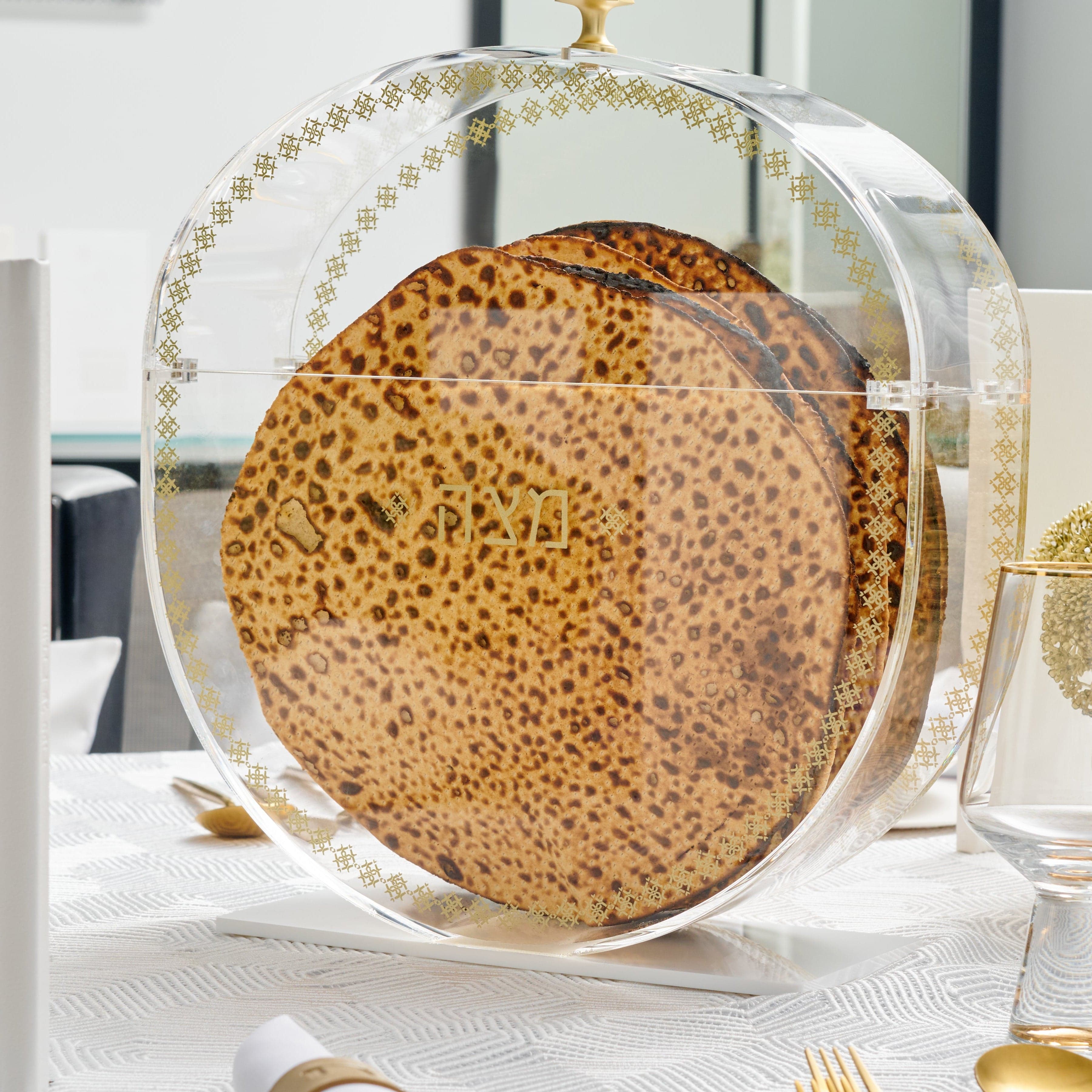 Standing Inspired Matzah Box with gold accents showcasing round matzahs on an elegant Passover table