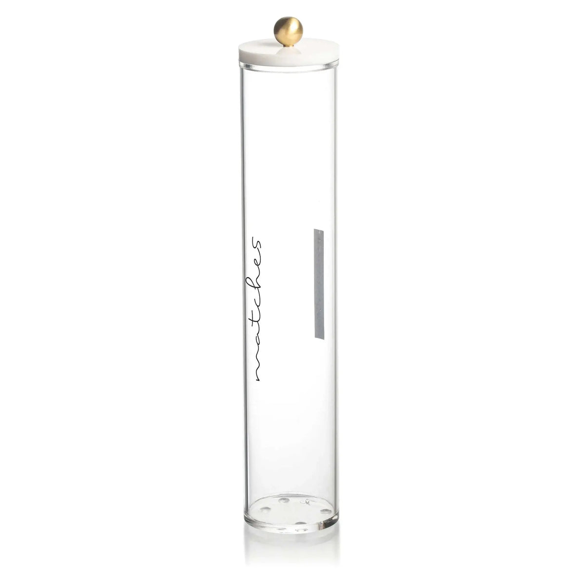 Tall clear glass cylinder match holder by Waterdale Collection with white ceramic lid and gold finial, featuring gray striker pad.