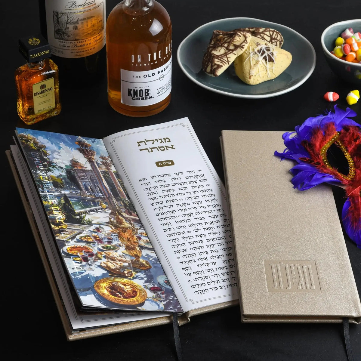 Tall leather Megillah case in cream with embossed Hebrew text, displayed among Purim celebration items including whiskey bottles and a decorative mask.
