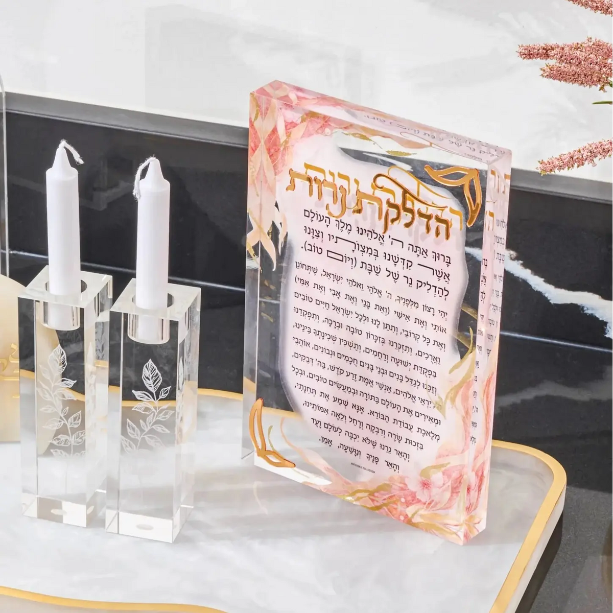 Watercolor Flowers Hadlakos Neiros Block with clear glass candlesticks and white flowers on marble surface for candle-lighting.