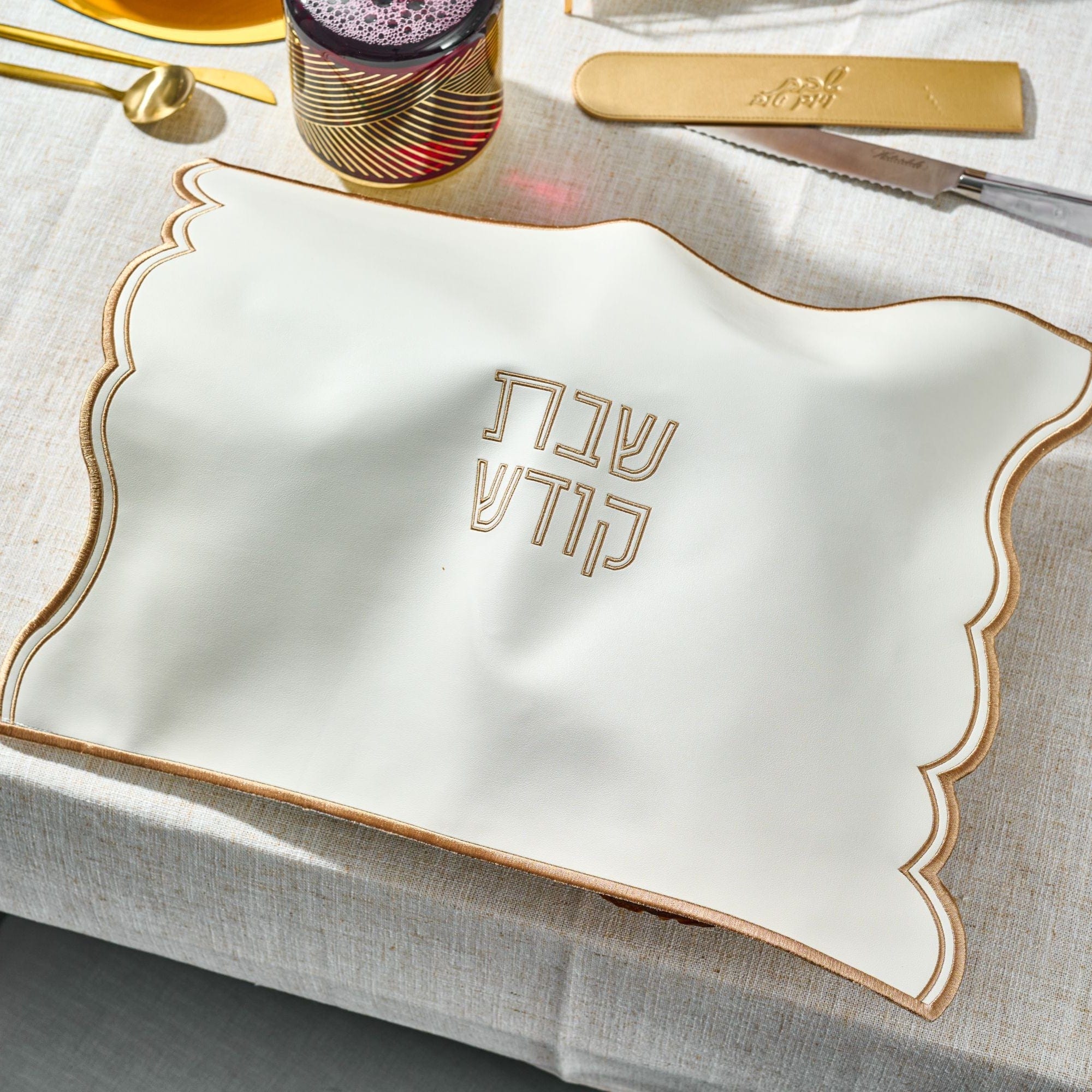 Wave Edge Challah Cover on a festive Shabbat table setting.